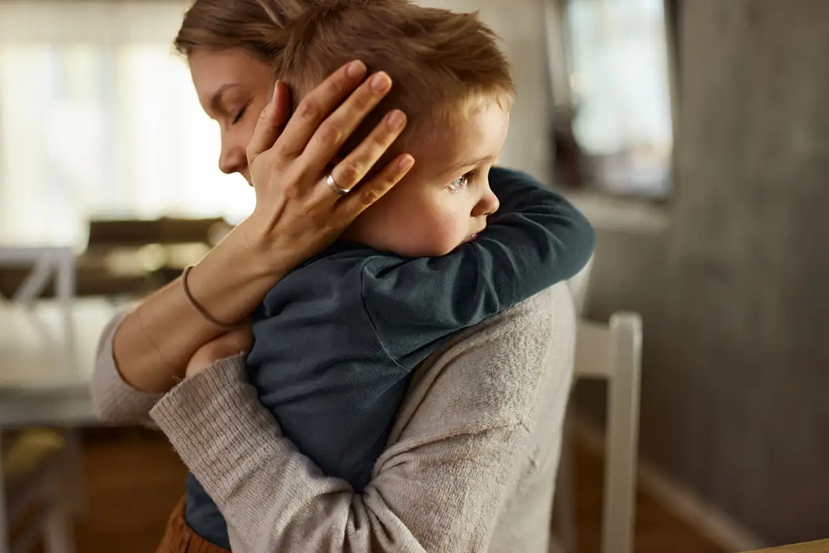 mom holding child